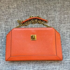 MCM Orange Crossbody Bag with Sleek Design and Versatile Style